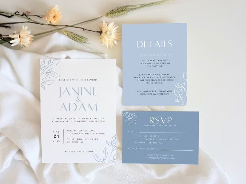 dusty blue wedding invite template with soft blue floral elements