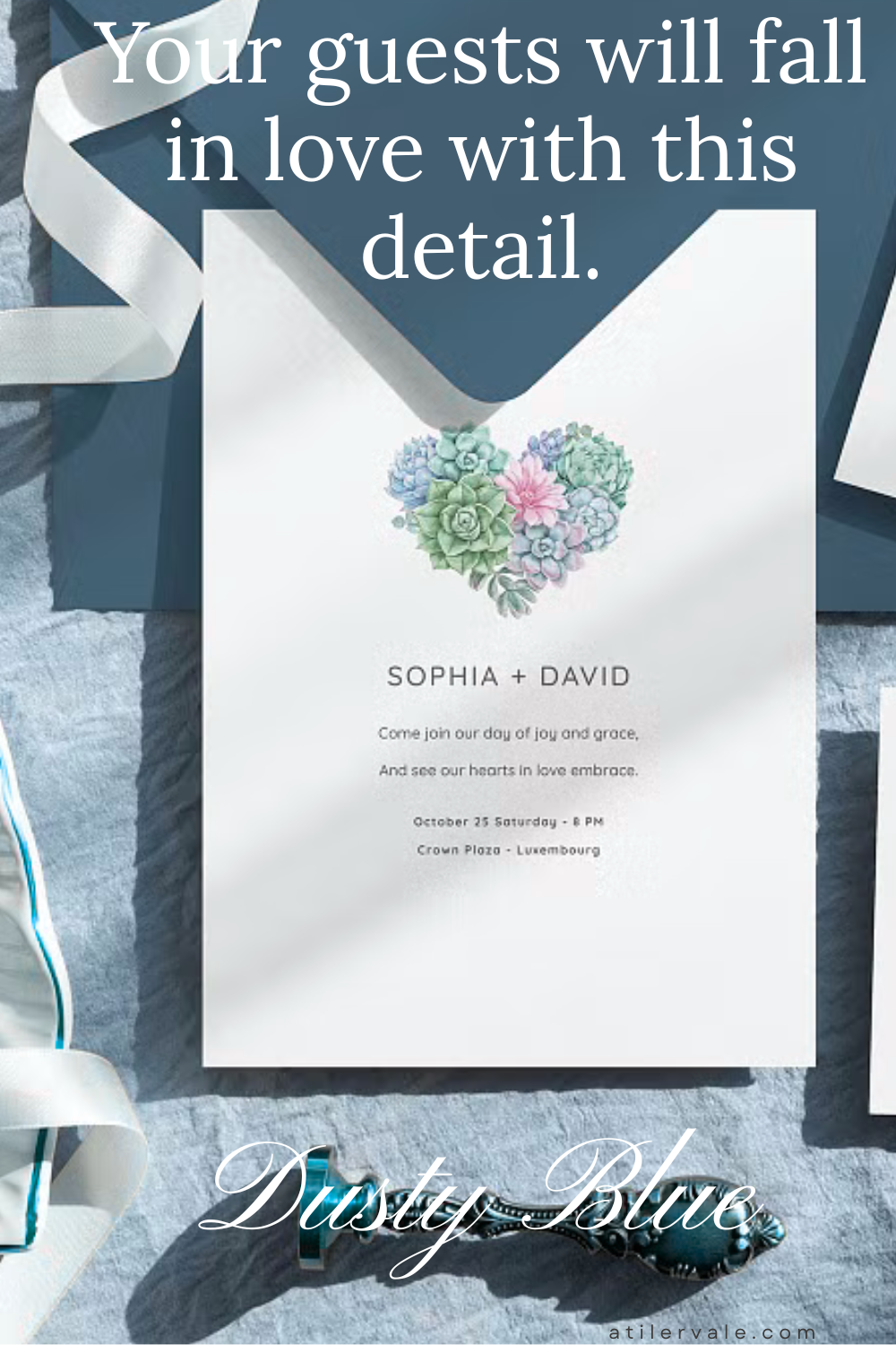 A vertical Pinterest pin featuring a white wedding invitation with a heart made of succulents. The invitation is placed on a dusty blue envelope with a white silk ribbon and a vintage wax seal stamp. Text overlay says "Your guests will fall in love with this detail."